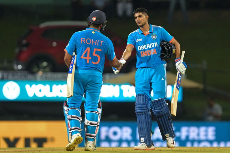 India's Rohit Sharma, left, and Shubman Gill celebrate their win over Nepal. AFP