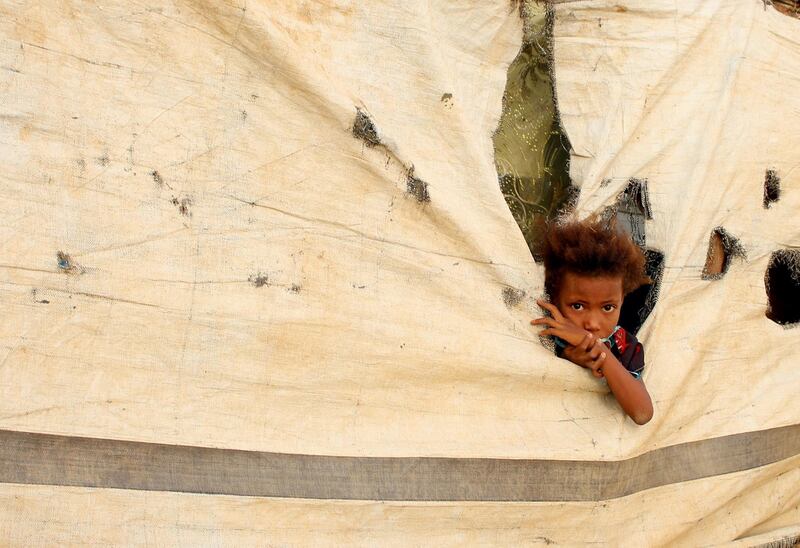 A Yemeni child who fled the fighting in Hodeidah is pictured at a makeshift camp in the district of Abs, in Yemen's northwestern Hajjah province.   AFP
