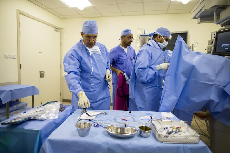 Doctors in the operating theatre at an Abu Dhabi hospital (Christopher Pike / The National)