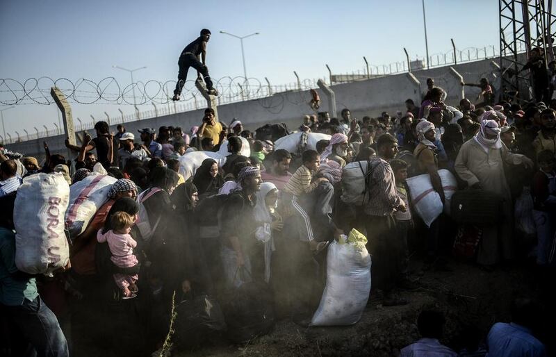 Turkey had for several days been blocking the Syrians from entering Turkey. Bulent Kilic/AFP Photo