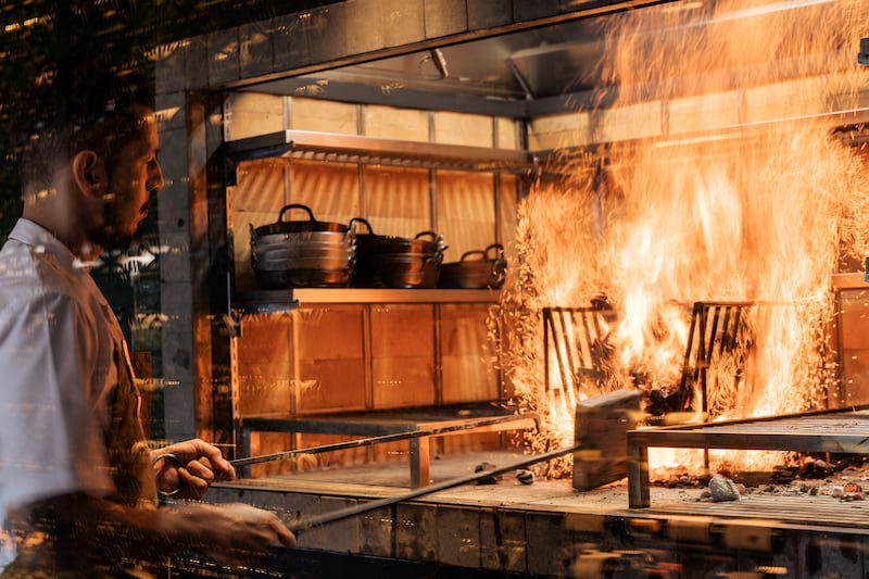 The restaurant is famous for its open-fire cooking techniques.