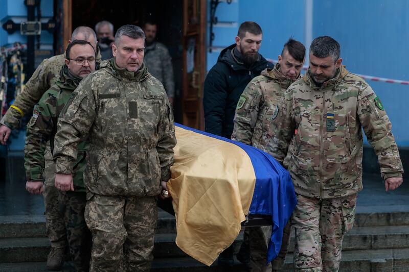 The coffin of Valeriy Krasnyan is brought out of St. Michael's Golden-Domed Monastery in Kyiv. Getty Images
