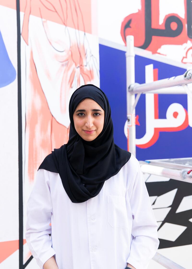 DUBAI, UNITED ARAB EMIRATES. 25 JULY 2020. 
Artist Reem Al Mazrouei works on their commission for Dubai Culture. They are painting a “Hope mural” to celebrate the UAE Mars mission in Dubai’s Al Fahidi district. (Photo: Reem Mohammed/The National)

Reporter:
Section: