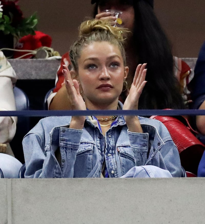 epa07800425 US model Gigi Hadid applauds during match between Serena Williams of the USA and Catherine McNally of the USA on the third day of the US Open Tennis Championships at the USTA National Tennis Center in Flushing Meadows, New York, USA, 28 August 2019. The US Open runs from 26 August through 08 September.  EPA-EFE/JASON SZENES