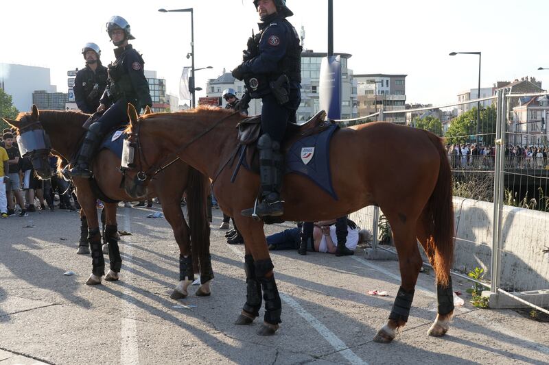 Police officers on horseback as Spanish fans gather near Stade de France. Getty