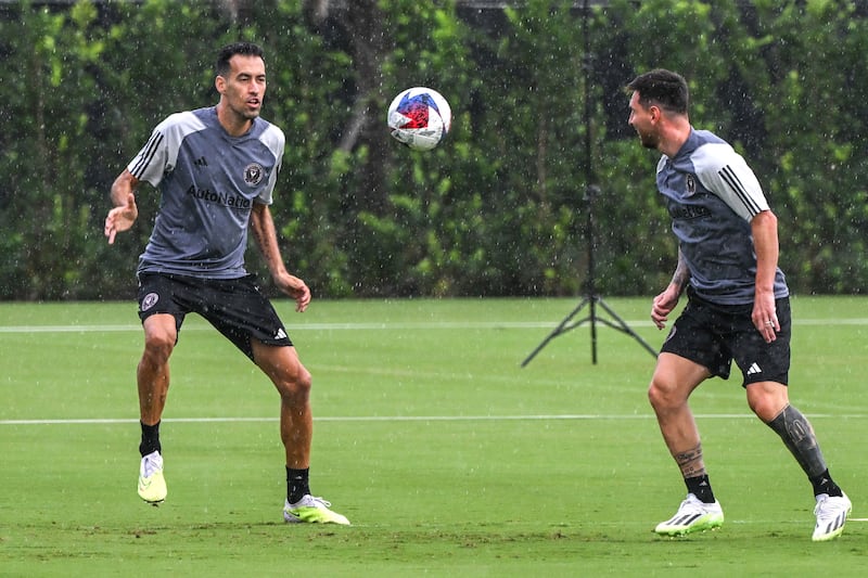 Inter Miami's Lionel Messi, right, and Sergio Busquets train. AFP