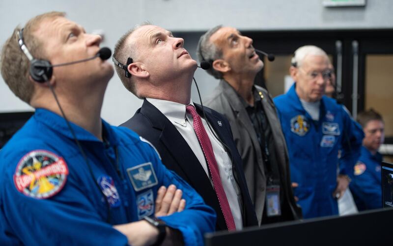 NASA astronaut Eric Boe (left), assistant to the chief of the astronaut office for commercial crew, and Norm Knight, deputy director of flight operations at NASA's Johnson Space Center, watch the launch of a SpaceX Falcon 9 rocket. EPA