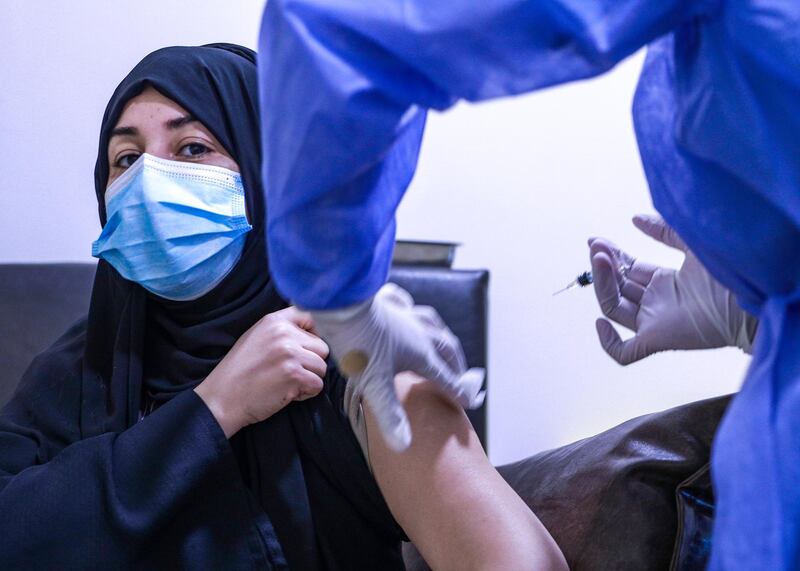 Abu Dhabi, United Arab Emirates, December 13, 2020.  Aysha Mohammed Ahmad Ali went to Abu Dhabi from Al Ain to get vaccinated at the Burjeel Hospital.
Victor Besa/The National
Section:  NA