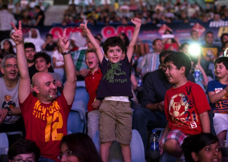 Fans cheer during WWE Live at Zayed Sports City in Abu Dhabi  Christopher Pike / The National