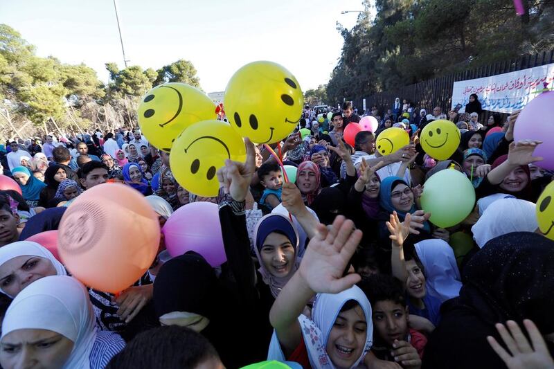 Children race to get balloons in Amman, Jordan. Muhammad Hamed / Reuters