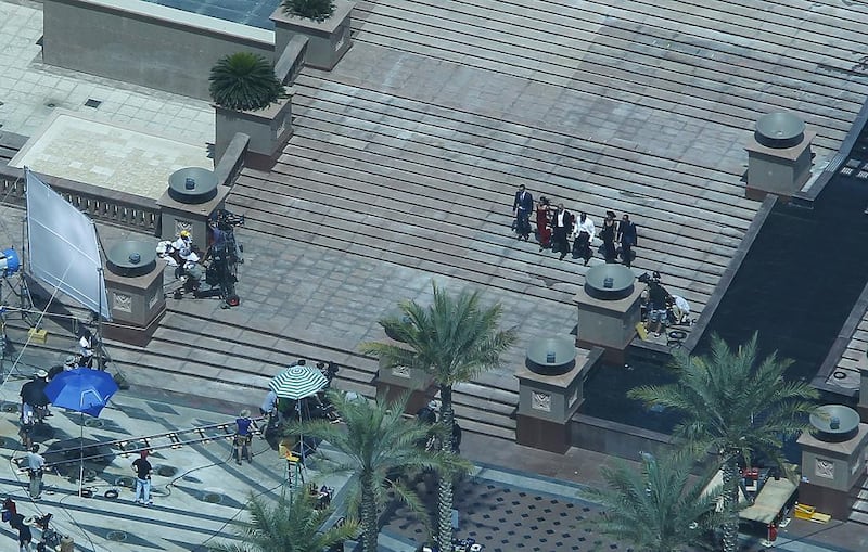 The cast of Fast & Furious 7, including Michelle Rodriguez and Vin Diesel, centre, on set at Emirates Palace in Abu Dhabi. Jeffrey E Biteng / The National 