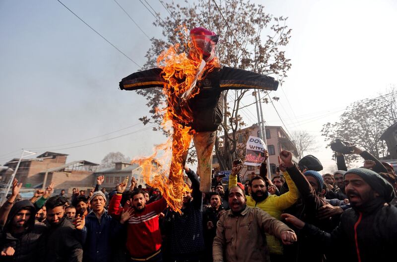 Demonstrators burn an effigy of US president Donald Trump in Srinagar on December 8, 2017. Danish Ismail / Reuters