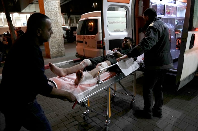 A Palestinian is taken for treatment to the Palestine Medical Complex in the West Bank city of Ramallah on Friday after being wounded in a rampage by Israeli settlers. AP Photo