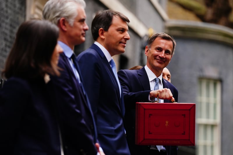 Britain's Chancellor Jeremy Hunt leaves No 11 Downing Street before delivering his budget at the Houses of Parliament. PA