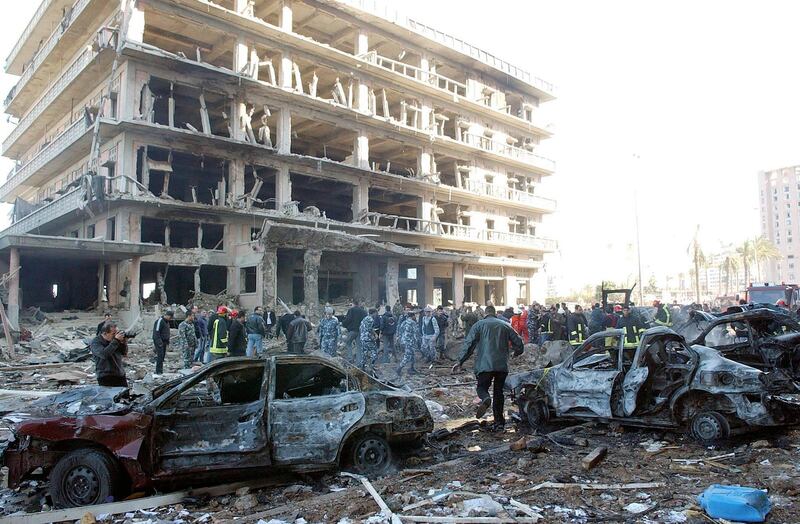 epa08611223 (FILE) - Emergency personnel inspect the scene after of a car bomb that killed former Lebanese Prime Minister Rafic Hariri, in Beirut, Lebanon, 14 February 2005 (Reissued 18 August 2020). On 18 August 2020, Judges of the UN-backed Special Tribunal for Lebanon in the Netherlands found Salim Ayyash, a member of the Hezbollah militant group, guilty of involvement in the assassination of former Lebanese Prime Minister Rafic Hariri and 21 others on 14 February 2005.  EPA-EFE/WAEL HAMZEH