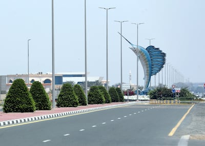 Umm Al Quwain, United Arab Emirates - Reporter: N/A: Corona. A quiet road leading to the Sailfish statue due to the Covid-19 outbreak. Saturday, April 18th, 2020. Umm Al Quwain. Chris Whiteoak / The National