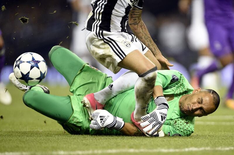 Real Madrid’s goalkeeper Keylor Navas in action against Juventus’ Dani Alves. Gerry Penny / EPA