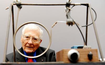 The late scientist and inventor James Lovelock poses with one of his early inventions, a homemade Gas Chromatography device, used for measuring gas and molecules present in the atmosphere. AP Photo