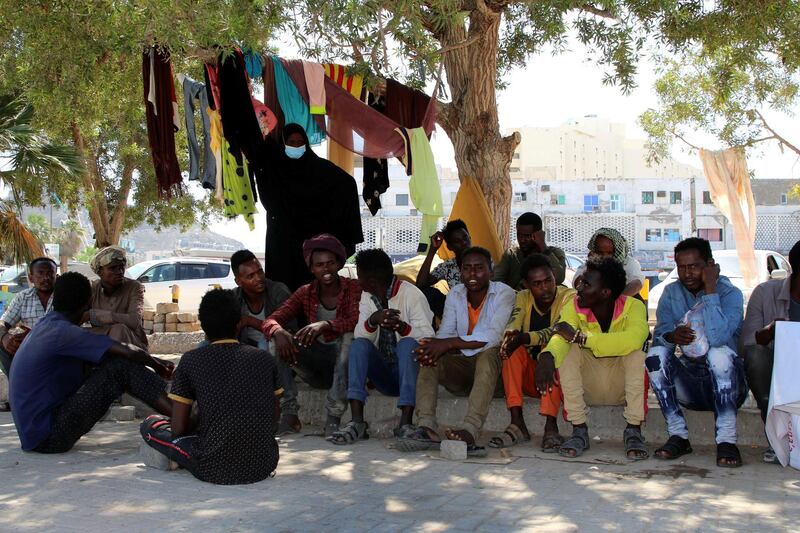 Ethiopian migrants gather to protest their treatment in the war-torn country during a sit-in outside a compound of United Nations organizations in the southern port city of Aden, Yemen March 15, 2021.  Picture taken March 15, 2021. REUTERS/Fawaz Salman
