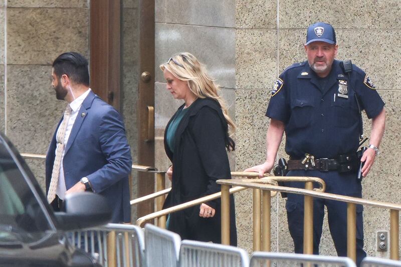 Stormy Daniels, the adult film star who allegedly received a hush-money payment from the Trump campaign in 2016, leaves court. AFP