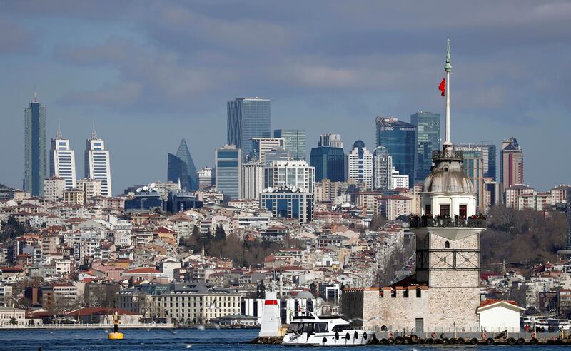 Maiden's Tower, an islet on the Bosphorus, is pictured with the city's skyscrapers in the background in Istanbul, Turkey. Reuters