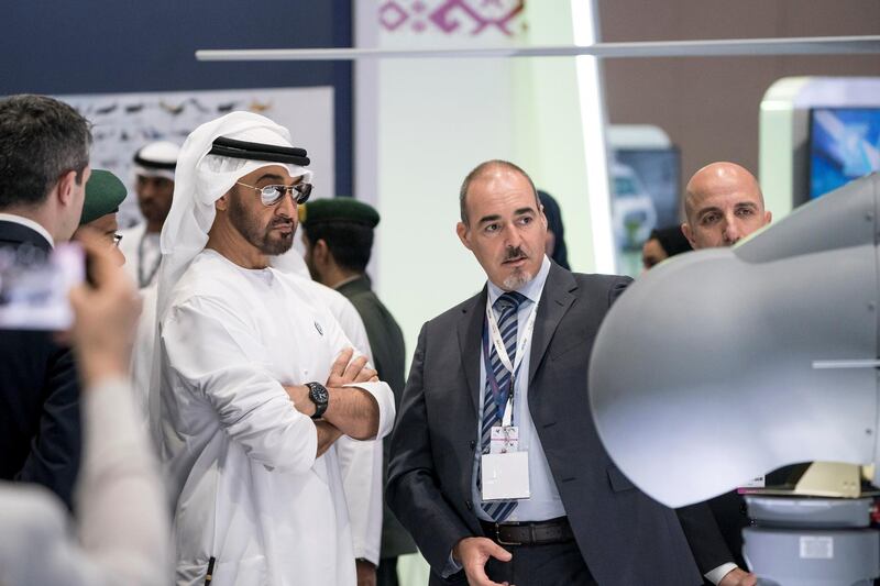 ABU DHABI, UNITED ARAB EMIRATES - February 27, 2018: HH Sheikh Mohamed bin Zayed Al Nahyan, Crown Prince of Abu Dhabi and Deputy Supreme Commander of the UAE Armed Forces (center L), tours the Unmanned Systems Exhibtion and Conference (UMEX) 2018 at the Abu Dhabi National Exhibition Centre (ADNEC).  
( Ryan Carter for the Crown Prince Court - Abu Dhabi )
---