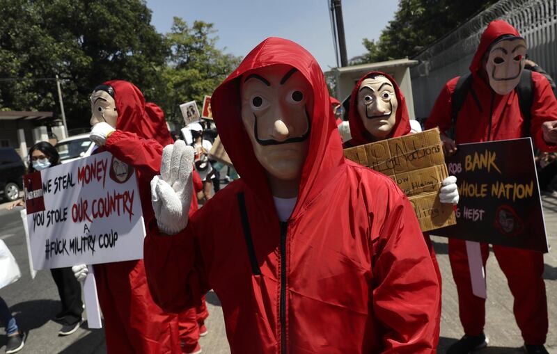 Demonstrators dressed as characters from the Spanish television series 'La Casa de Papel' (Money Heist) flash the three-finger salute and hold placards during a protest against the military coup outside the Russian Embassy in Yangon, Myanmar. People continued to rally across the country despite orders banning mass gatherings and reports of increasing use of force by police against anti-coup protesters. Myanmar's military seized power and declared a state of emergency for one year after arresting State Counselor Aung San Suu Kyi and Myanmar president Win Myint in an early morning raid on 01 February.  EPA