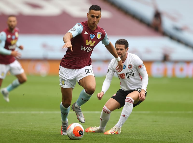 Anwar El Ghazi of Aston Villa is challenged by Ollie Norwood of Sheffield United. Getty