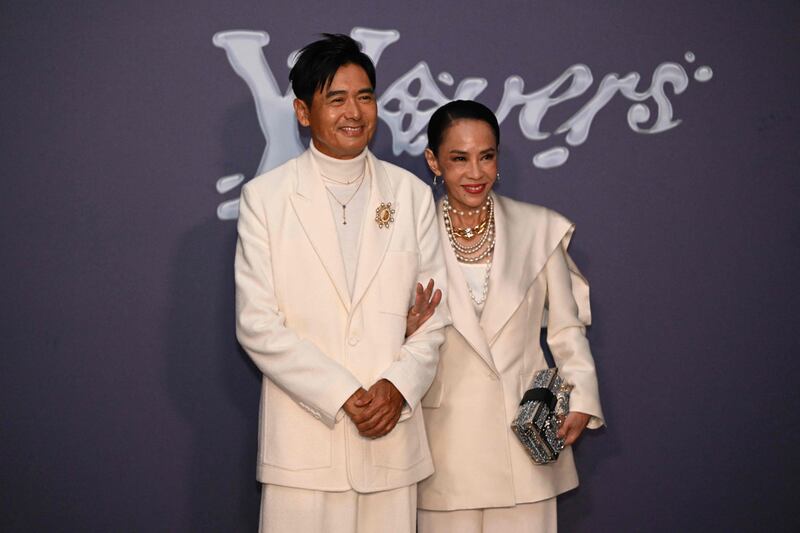 Hong Kong actor Chow Yun-fat and his wife Jasmine Tan at the LV x Pharrell Williams show. AFP