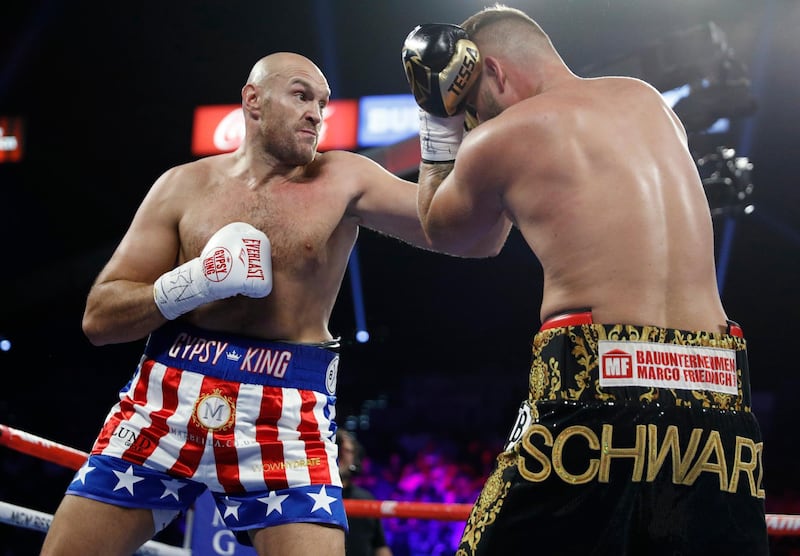 Tyson Fury, left, of England, tries to hit Tom Schwarz, of Germany, with a left during a heavyweight boxing match in Las Vegas. AP Photo