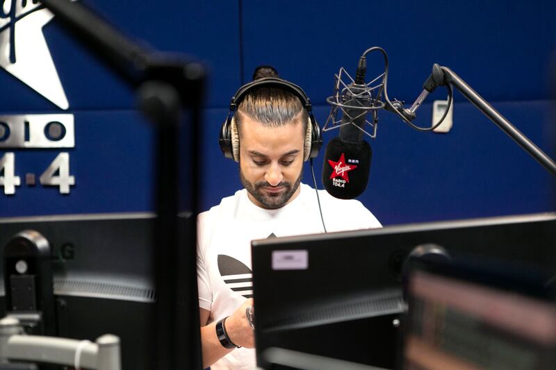 DUBAI, UNITED ARAB EMIRATES, AUGUST 3, 2016. RJ Kris Fade of The The Kris Fade Show in their studio at Arabian Radio Network offices. Photo: Reem Mohammed / The National  (Reporter: Afshan Ahmed / Section: AL) ID 20528 *** Local Caption ***  RM_20160803_ARN_003.JPG