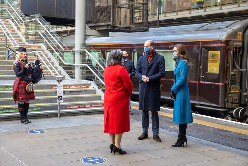Prince William and Catherine, Duchess of Cambridge are met by Deputy Lord Lieutenant Sandra Cumming as they arrive by train at Edinburgh Waverley Station. Getty Images