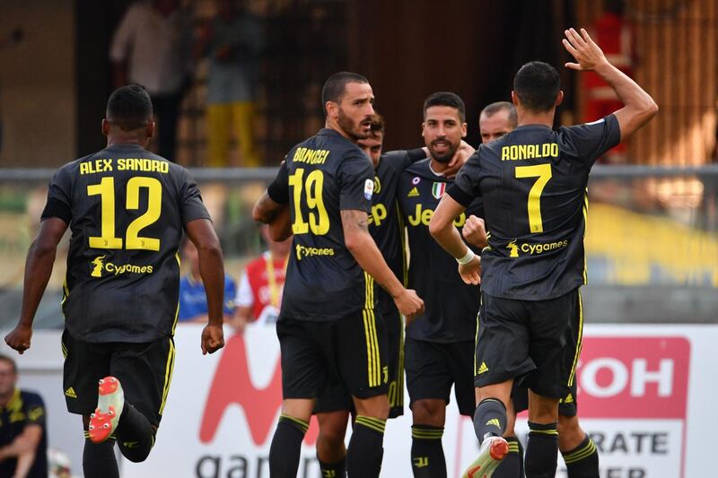 Juventus players celebrate their opening goal. AFP