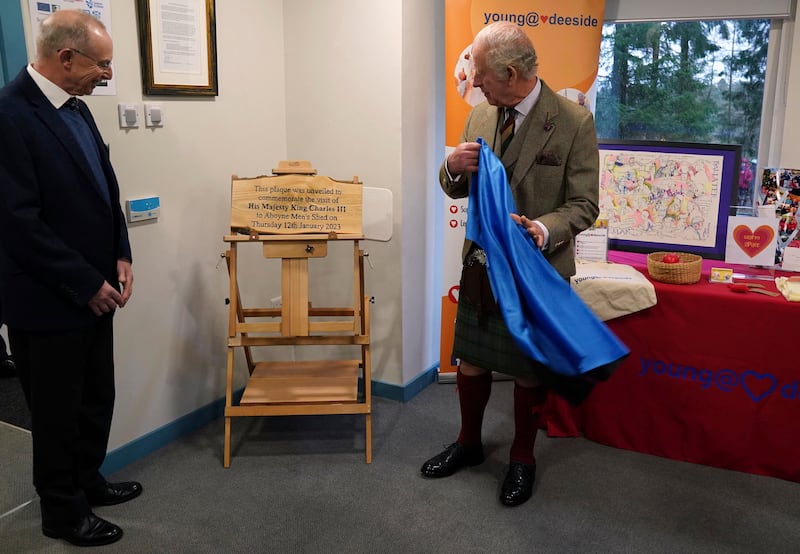 King Charles unveils a plaque in his honour during the visit in Aberdeenshire. AP