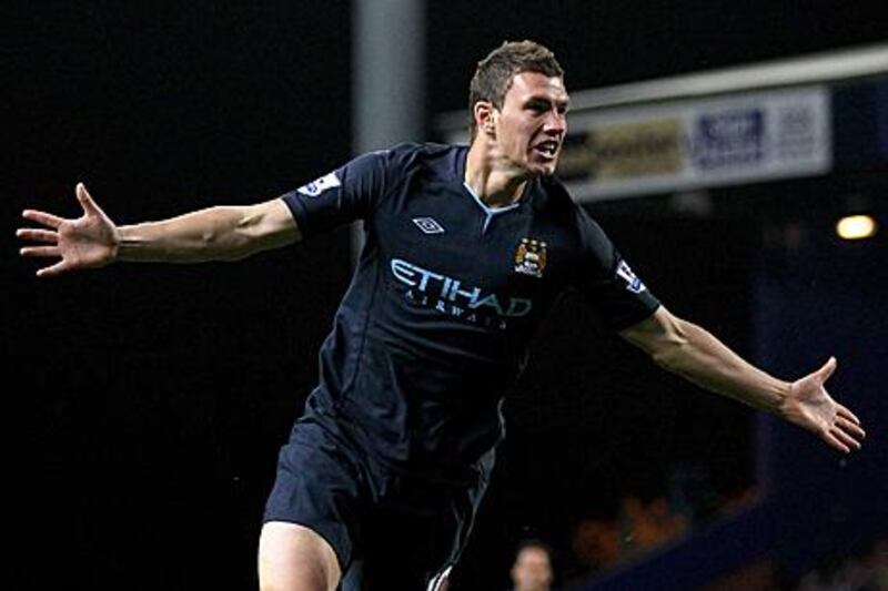 Edin Dzeko celebrates his first Premier League goal for Manchester City in their crucial 1-0 win at Blackburn Rovers.