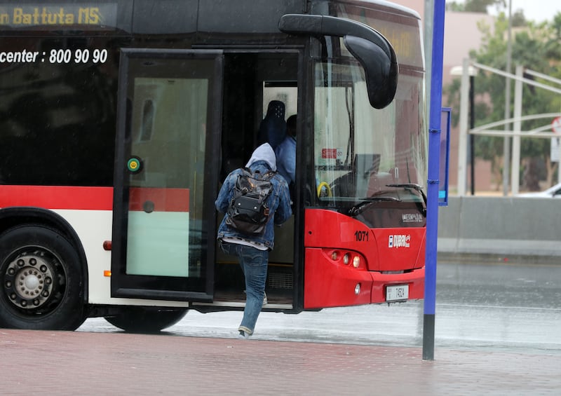 Dubai bus passengers are glad to get out of the rain