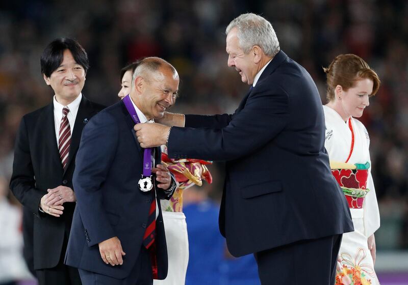 England head coach Eddie Jones receives his medal as Japan's Crown Prince Akishino looks on. Reuters