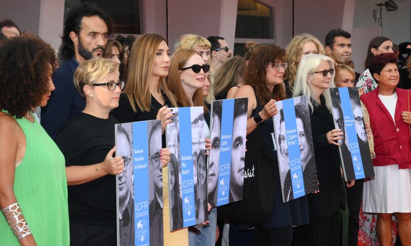 The protest was held during the premiere of Panahi's latest film on Friday. EPA 
