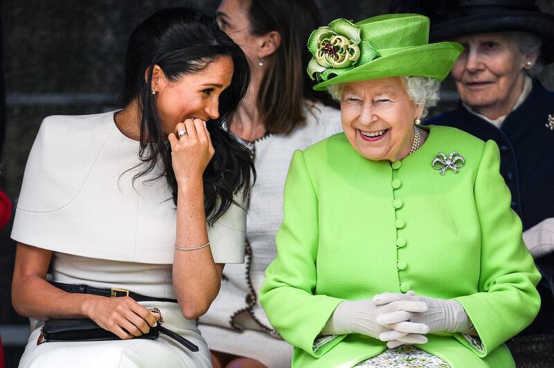 CHESTER, ENGLAND - JUNE 14:  Queen Elizabeth II sitts and laughs with Meghan, Duchess of Sussex during a ceremony to open the new Mersey Gateway Bridge on June 14, 2018 in the town of Widnes in Halton, Cheshire, England. Meghan Markle married Prince Harry last month to become The Duchess of Sussex and this is her first engagement with the Queen. During the visit the pair will open a road bridge in Widnes and visit The Storyhouse and Town Hall in Chester.  (Photo by Jeff J Mitchell/Getty Images)