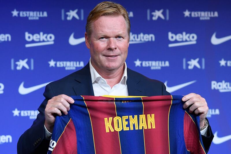 Barcelona's new Dutch coach Ronald Koeman poses during his official presentation at the Camp Nou stadium in Barcelona on August 19, 2020. - Crisis-hit Barcelona hailed the "return of a legend" as the Spanish giants today officially named Ronald Koeman as their new coach until 2022. (Photo by Josep LAGO / AFP)