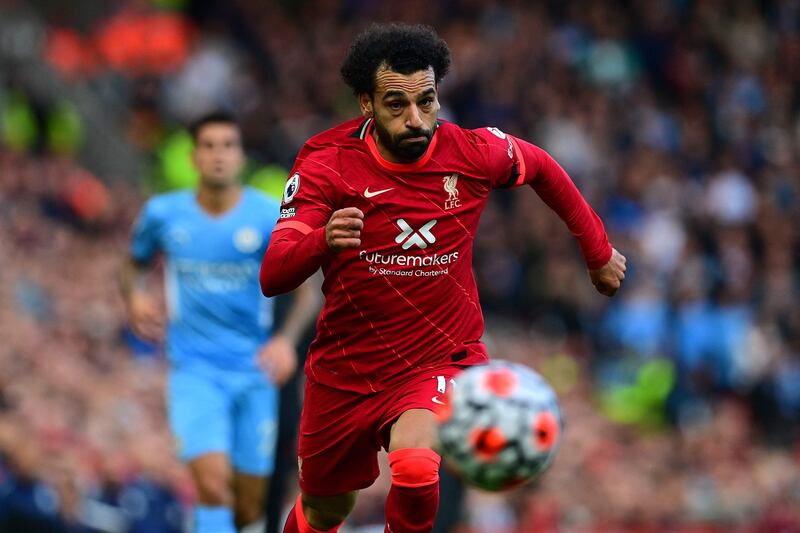 Liverpool's Egyptian midfielder Mohamed Salah runs for the ball during the English Premier League football match between Liverpool and Manchester City at Anfield in Liverpool, northwest England, on October 3, 2021.  (Photo by Paul ELLIS / AFP) / RESTRICTED TO EDITORIAL USE.  No use with unauthorized audio, video, data, fixture lists, club/league logos or 'live' services.  Online in-match use limited to 120 images.  An additional 40 images may be used in extra time.  No video emulation.  Social media in-match use limited to 120 images.  An additional 40 images may be used in extra time.  No use in betting publications, games or single club/league/player publications.   /  