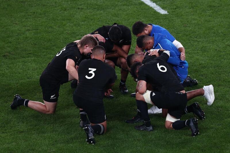 New Zealand's players pray after winning the  Japan 2019 Rugby World Cup quarter-final match between New Zealand and Ireland at the Tokyo Stadium in Tokyo. AFP