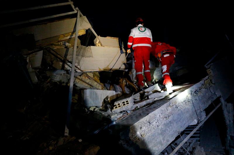 Rescue personnel conduct search and rescue work following a 7.3-magnitude earthquake at Sarpol-e Zahab in Iran's Kermanshah province on November 13, 2017.
At least 164 people were killed and 1,600 more injured when a 7.3-magnitude earthquake shook the mountainous Iran-Iraq border triggering landslides that were hindering rescue efforts, officials said.  / AFP PHOTO / ISNA / POURIA PAKIZEH