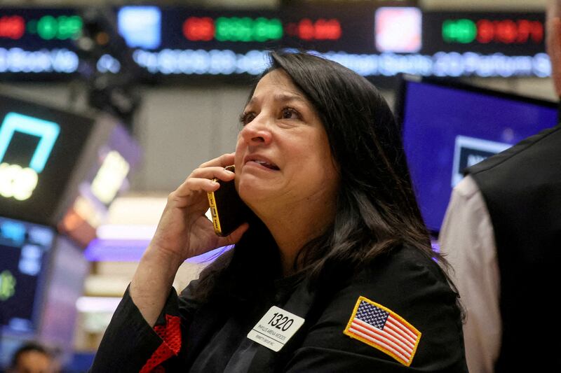 A trader at the New York Stock Exchange. While stock markets in the US, UK and Europe quickly recovered their exposure, local markets were deeply affected by the Israel-Gaza war. Reuters