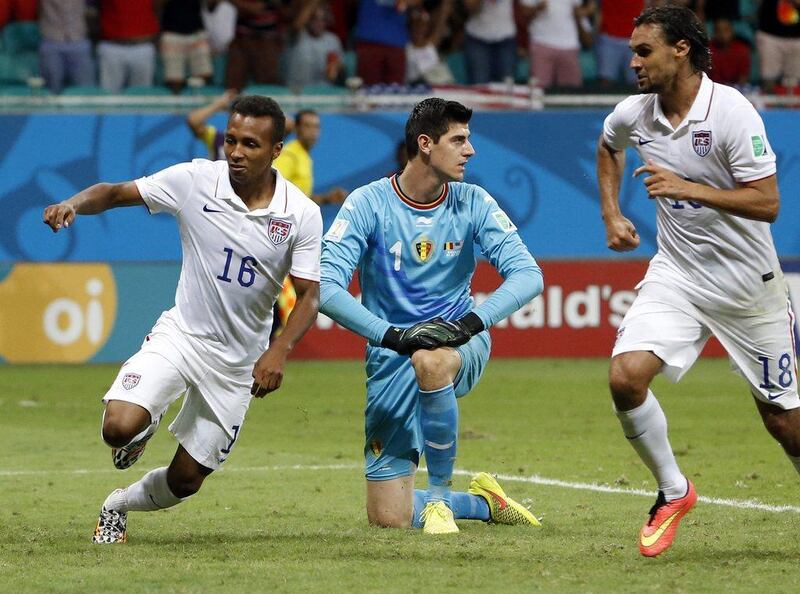 Julian Green begins to celebrate his goal against Belgium for the USA on Tuesday, with teammate Chris Wondolowski, while Belgium keeper Thibaut Courtois looks on at the 2014 World Cup. Guillaume Horcajuelo / EPA