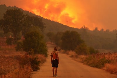 A resident looks on at the wildfire approaching the village of Avantas, northeast of Alexandroupolis, Greece, in August 2023. Getty Images