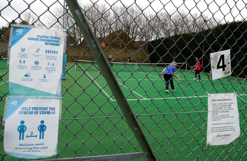 People play tennis as Leverstock Green Tennis Club reopens, amid the coronavirus disease (COVID-19) pandemic, in Leverstock Green, Britain, March 29, 2021. REUTERS/Paul Childs