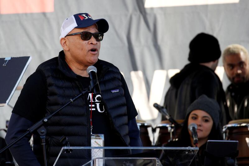 Comedian Larry Wilmore speaks at the second annual Women's March in Los Angeles. Patrick T Fallon / Reuters