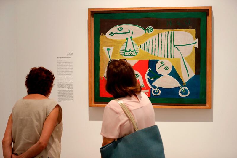 Visitors observe the artwork 'Mother and Children' (1951) by Spanish artist Pablo Picasso displayed at the Sursock Museum in Beirut. Joseph Eid / AFP