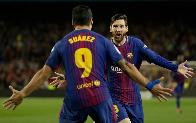 Former Barcelona players Lionel Messi and Luis Suarez. Both Real Madrid and FC Barcelona oppose the CVC private equity deal. AP